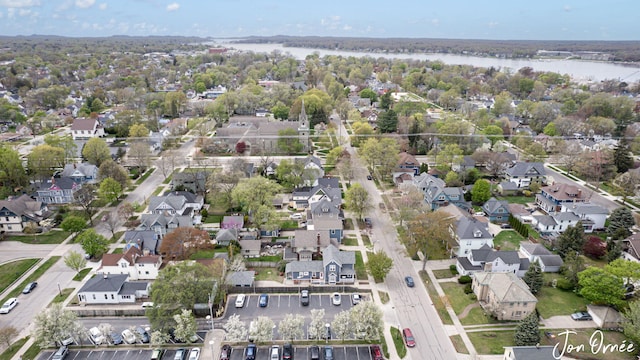 bird's eye view featuring a water view and a residential view