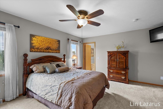 6332 Rush Creek Ct, Hudsonville, MI 49426 - carpeted bedroom with baseboards, a ceiling fan, and visible vents