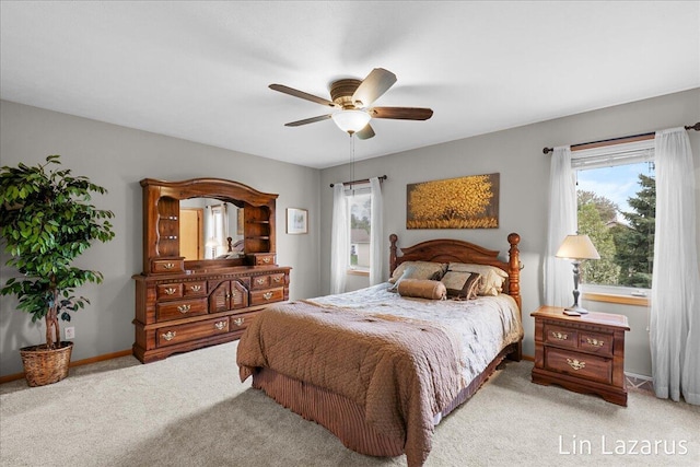 6332 Rush Creek Ct, Hudsonville, MI 49426 - bedroom with baseboards, light colored carpet, multiple windows, and ceiling fan