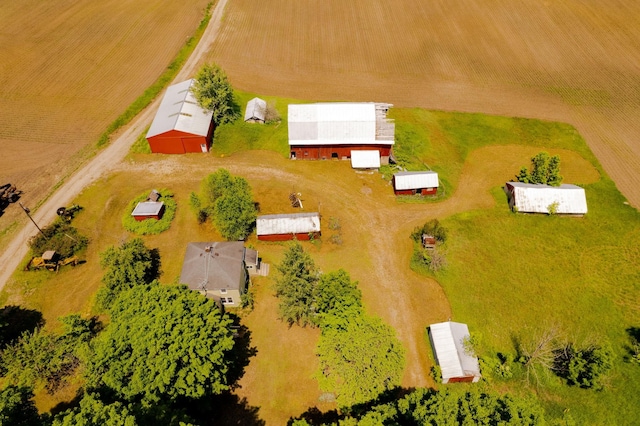 birds eye view of property with a rural view
