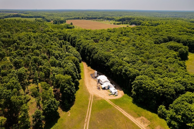 drone / aerial view featuring a forest view