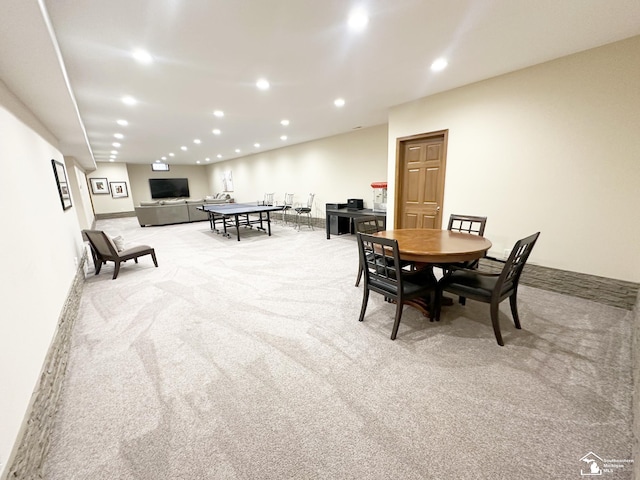 carpeted dining room with recessed lighting and baseboards