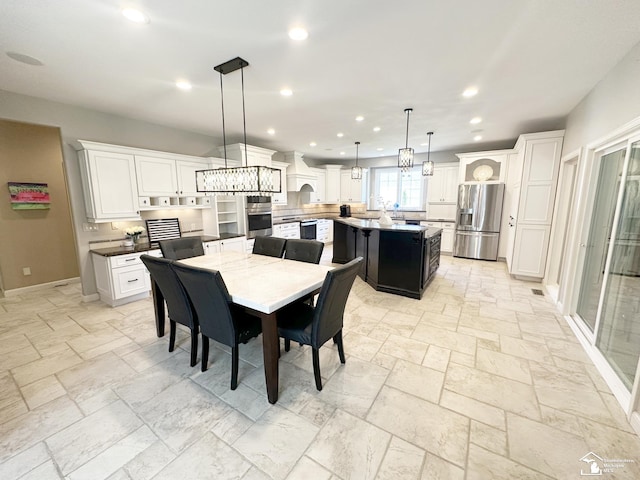 dining area with recessed lighting, baseboards, and stone tile flooring