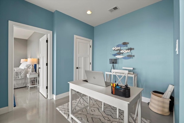office space featuring visible vents, recessed lighting, baseboards, and finished concrete floors