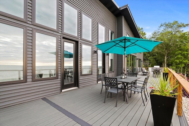 deck featuring outdoor dining area