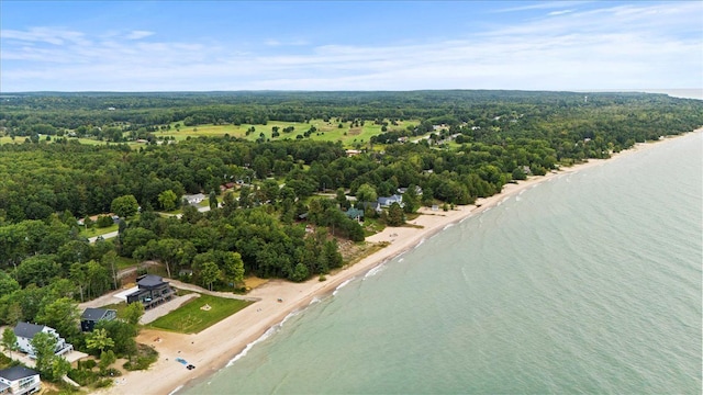 bird's eye view with a water view and a wooded view