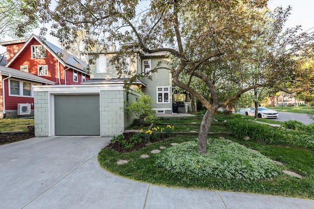 view of front of home featuring ac unit and concrete driveway