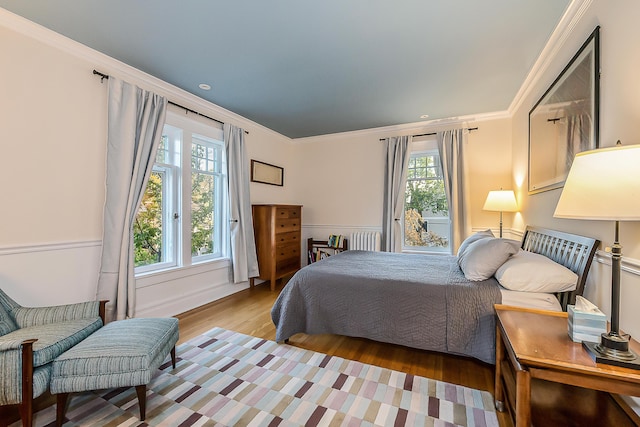 bedroom featuring crown molding, recessed lighting, and wood finished floors