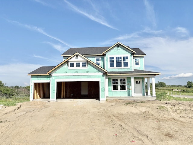 6612 Northfield Dr SW, Byron Center, MI 49315 - property under construction featuring covered porch, a garage, and roof with shingles
