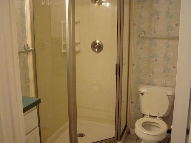 2010 Collegewood St, Ypsilanti, MI 48197 - full bathroom with tile patterned flooring, wallpapered walls, toilet, and a shower stall