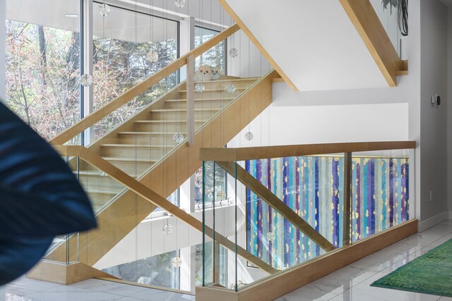 stairway featuring baseboards