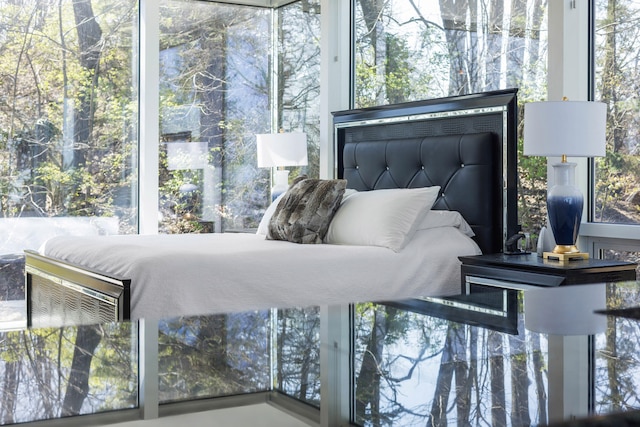 bedroom featuring multiple windows