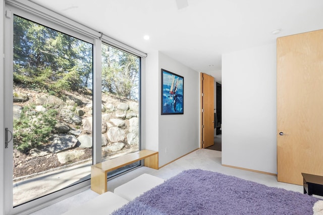 bedroom featuring baseboards and light colored carpet