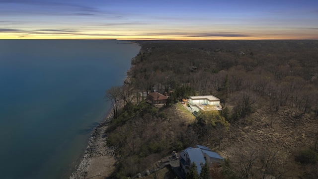 aerial view featuring a water view and a forest view