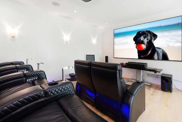 cinema room with recessed lighting and wood finished floors