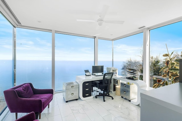 office with floor to ceiling windows, marble finish floor, ceiling fan, and visible vents
