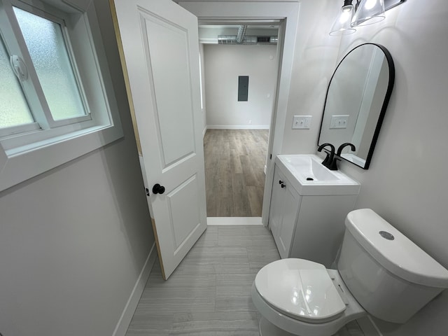 171 Davis St, Wyandotte, MI 48192 - bathroom with toilet, baseboards, and vanity