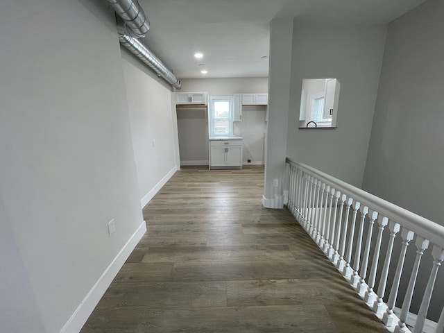 171 Davis St, Wyandotte, MI 48192 - corridor featuring an upstairs landing, wood finished floors, baseboards, and recessed lighting