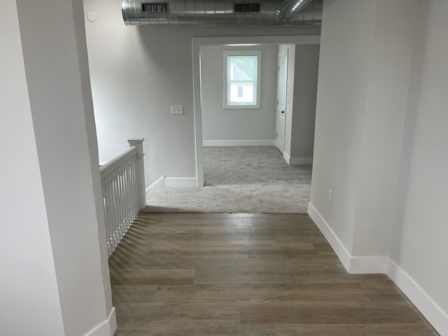 171 Davis St, Wyandotte, MI 48192 - hall with baseboards, an upstairs landing, and wood finished floors