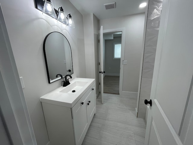 171 Davis St, Wyandotte, MI 48192 - bathroom featuring vanity and baseboards