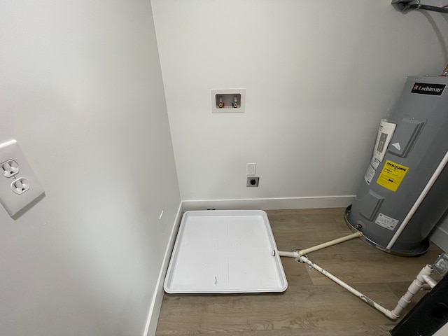 171 Davis St, Wyandotte, MI 48192 - laundry room with hookup for an electric dryer, hookup for a washing machine, water heater, wood finished floors, and baseboards