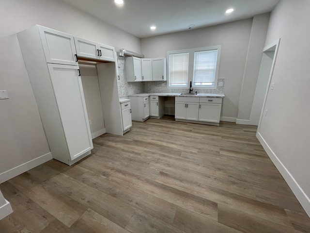 171 Davis St, Wyandotte, MI 48192 - kitchen with a sink, white cabinetry, light wood finished floors, and recessed lighting