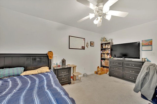 bedroom featuring carpet floors, a ceiling fan, and baseboards