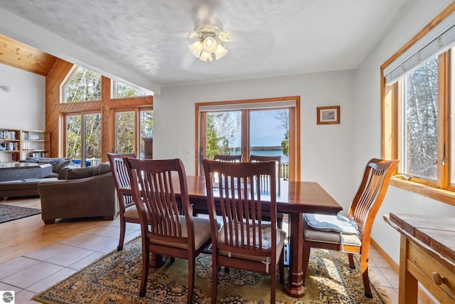 dining room with ceiling fan and light tile patterned floors
