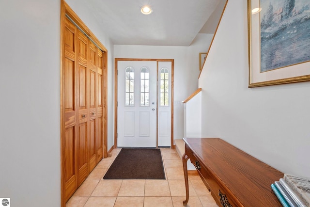 foyer featuring light tile patterned flooring and recessed lighting