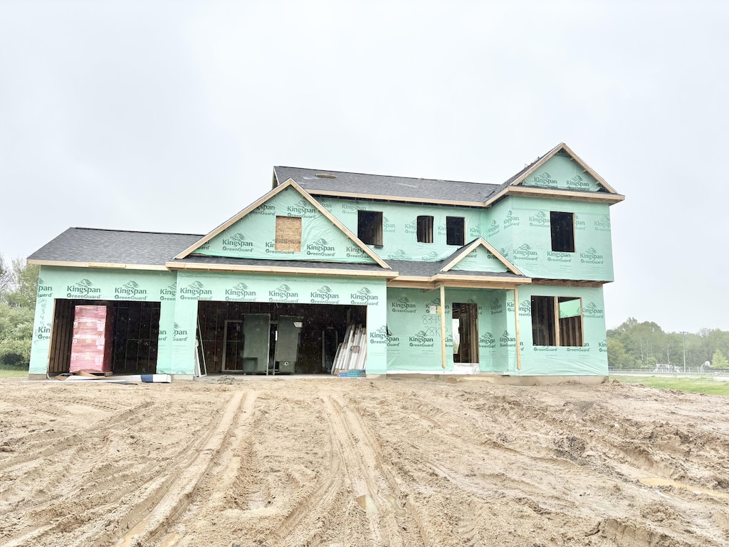 8345 Kettle Oak Dr SE, Alto, MI 49302 - property under construction featuring dirt driveway and a garage