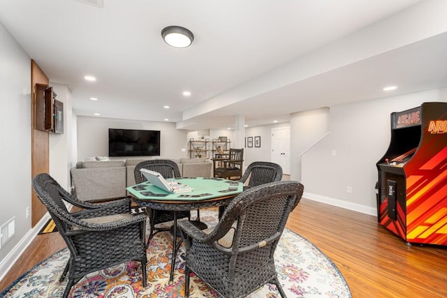 playroom featuring baseboards, recessed lighting, and light wood finished floors