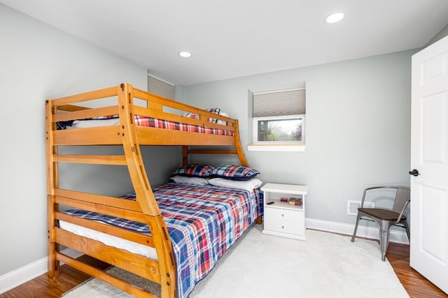 bedroom featuring baseboards, recessed lighting, and visible vents