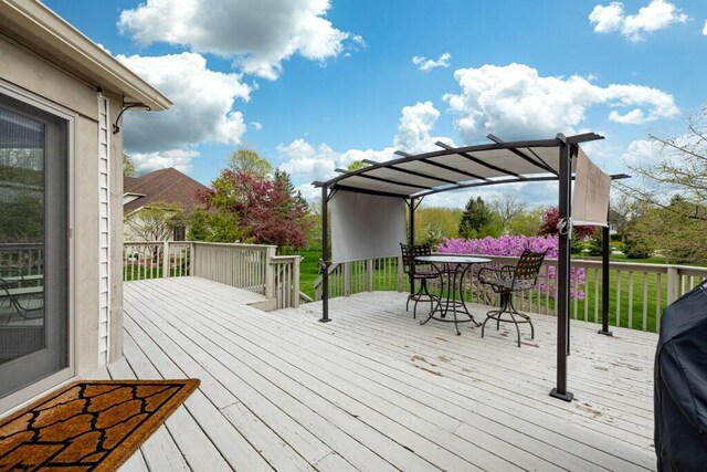wooden deck featuring outdoor dining area