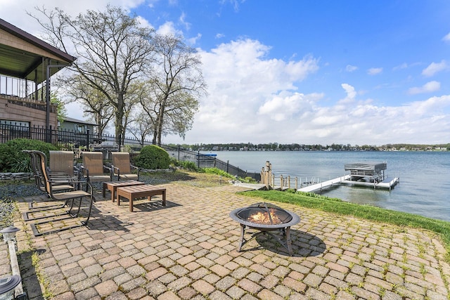 23848 Brady St, Edwardsburg, MI 49112 - view of patio / terrace featuring fence, boat lift, a water view, a dock, and a fire pit