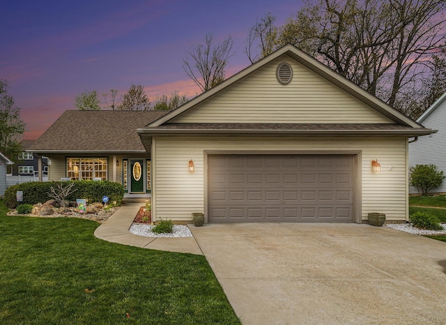 ranch-style house featuring concrete driveway, a lawn, and an attached garage