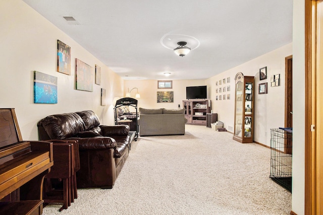 carpeted living area with visible vents