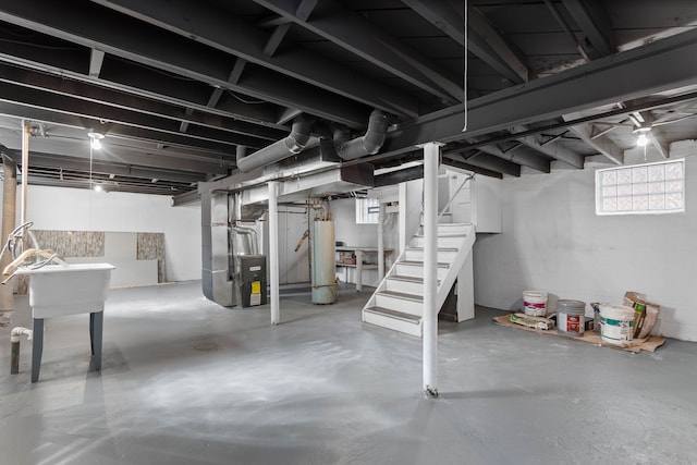 17193 Pierson St, Detroit, MI 48219 - basement featuring heating unit, water heater, and stairs