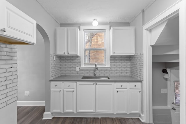 17193 Pierson St, Detroit, MI 48219 - kitchen with a sink, dark wood-style flooring, and white cabinetry