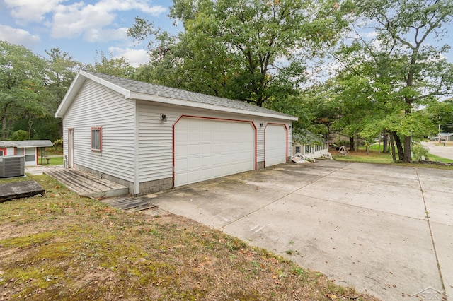 detached garage featuring central AC