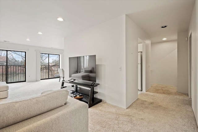 carpeted living room featuring recessed lighting