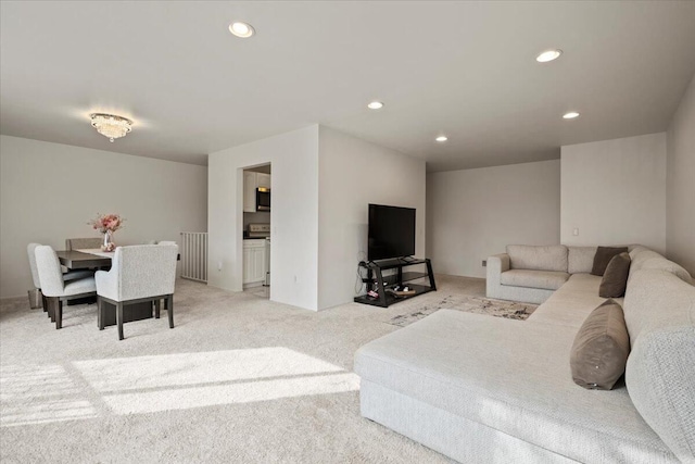 carpeted living room featuring recessed lighting