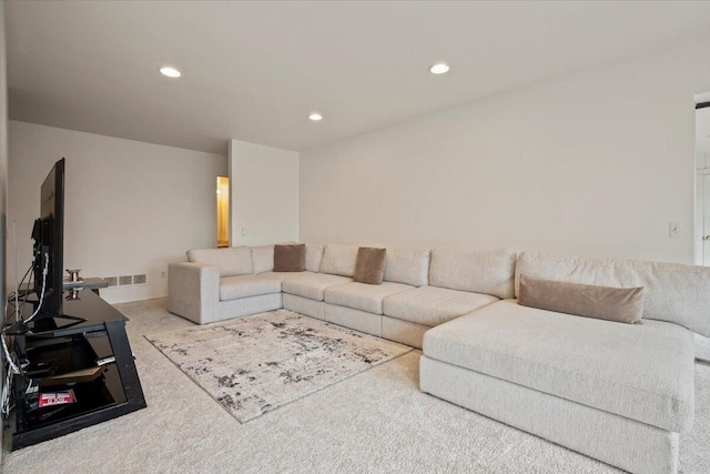 carpeted living area featuring recessed lighting and visible vents