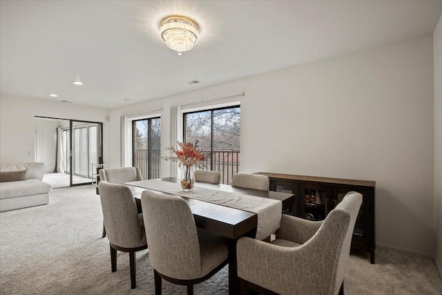 dining area featuring recessed lighting, light colored carpet, and visible vents