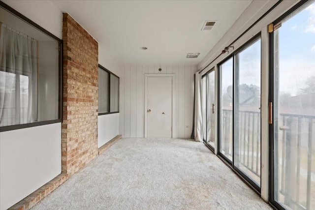 interior space featuring carpet floors and visible vents
