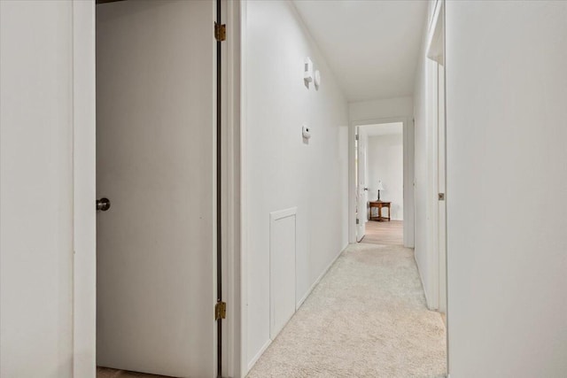corridor with light colored carpet