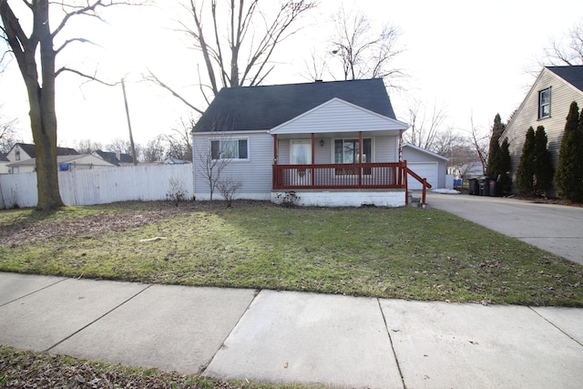 view of front facade with an outdoor structure, a garage, fence, covered porch, and a front yard