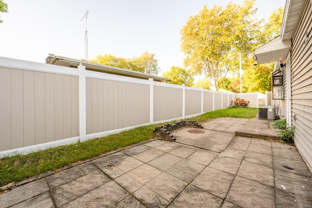 150 Hunter Dr, Benton Harbor, MI 49022 - view of patio / terrace featuring central AC unit and a fenced backyard