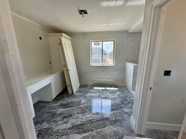 bathroom featuring marble finish floor