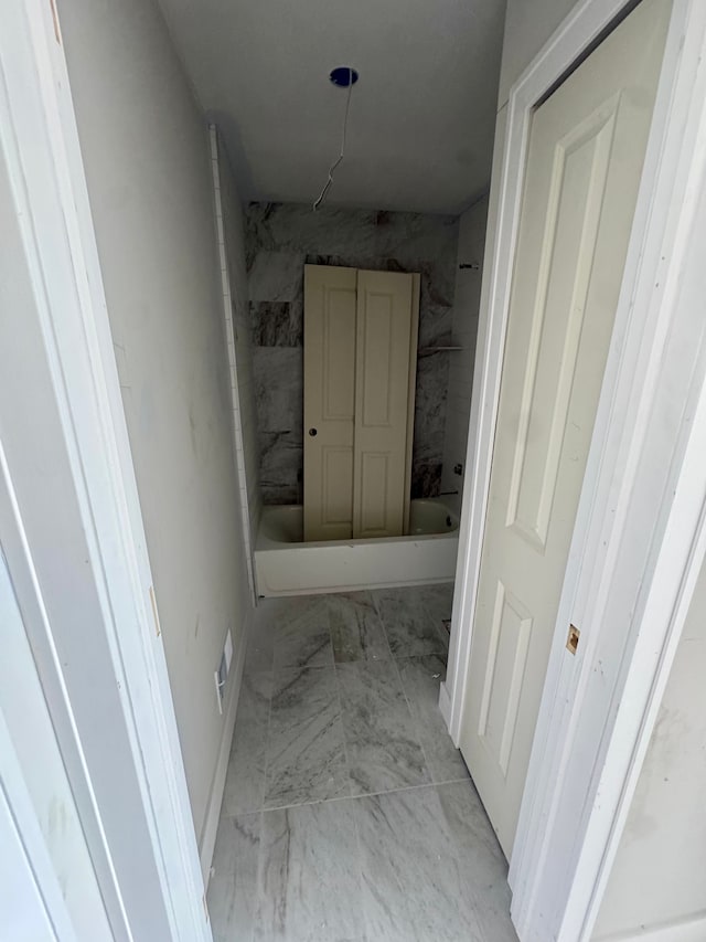 hall with marble finish floor