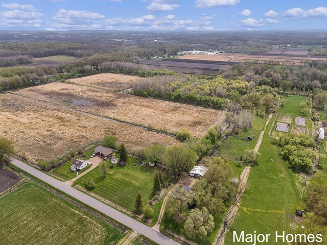 birds eye view of property featuring a rural view